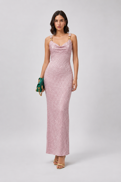 Woman wearing a pink evening gown on a white background